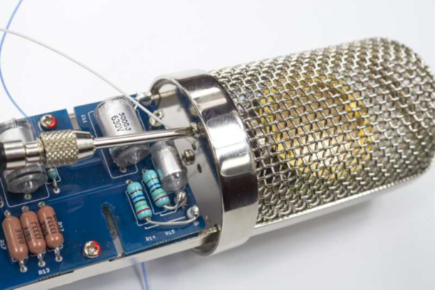 Headbasket being reassembled over the capsule after wiring is complete.